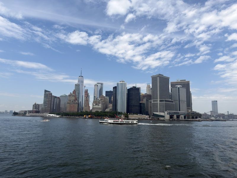 Lower Manhattan skyline from the water on a bright day