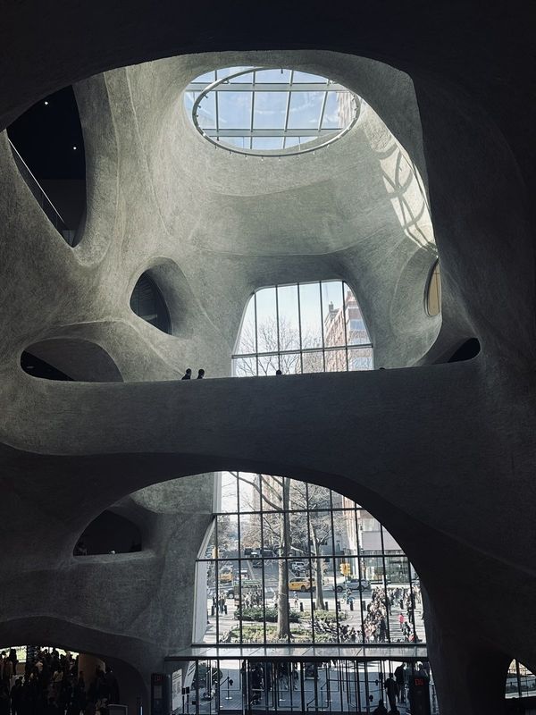 Sculpted concrete atrium with an oval skylight at the American Museum of Natural History